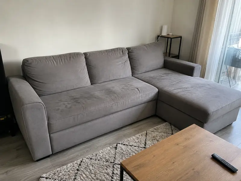 Canapé convertible gris avant nettoyage